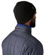 Back of a man wearing the Patagonia brodeo wool blend unisex beanie in black.