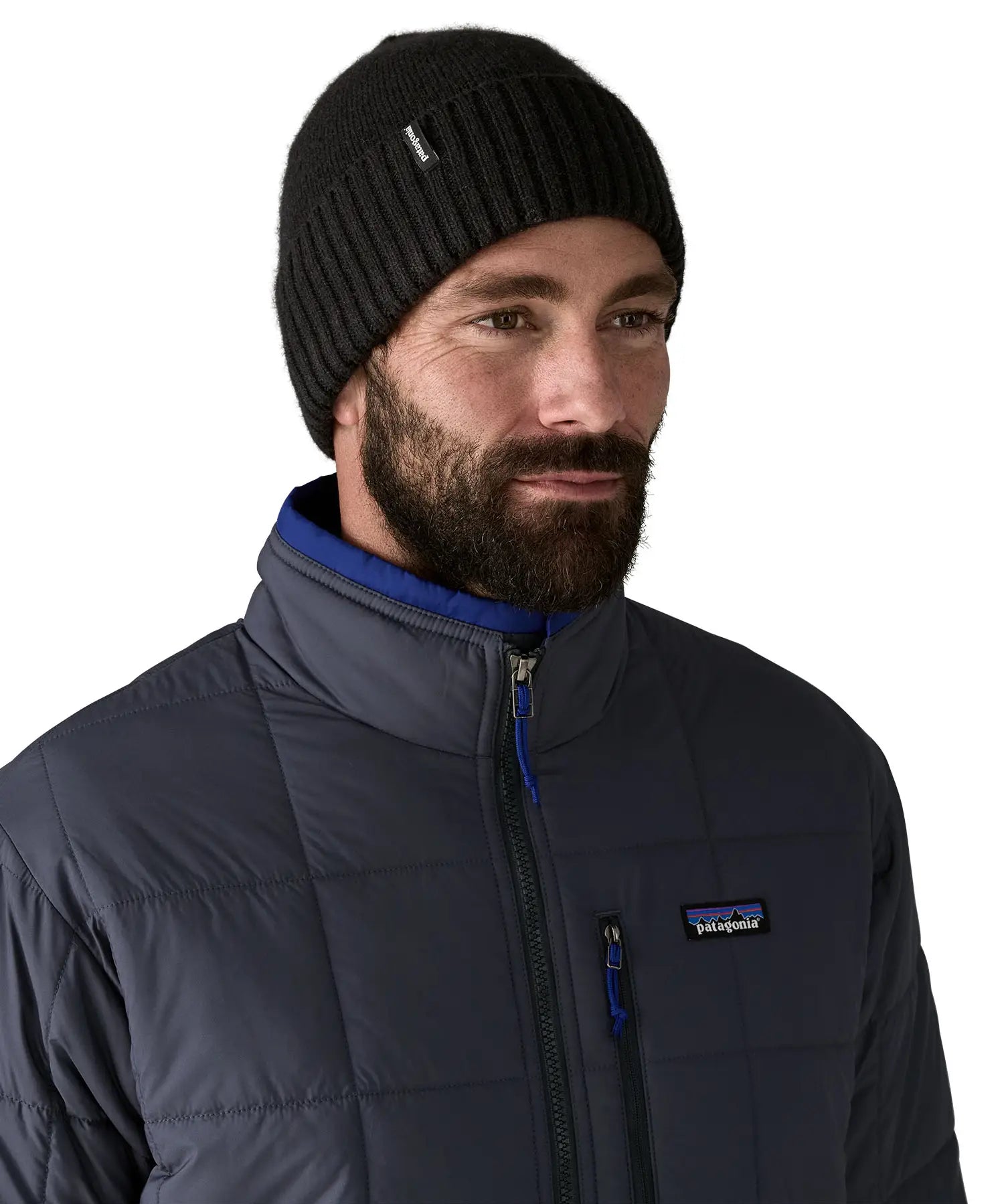 Man wearing the Patagonia brodeo wool blend unisex beanie in black.