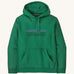 Patagonia adult hoodie in a green colour with the logo on the front on a cream background.