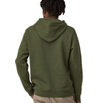 A man wearing a Patagonia Adult P-6 Logo Uprisal Hoody in a Torrey Pine Green colour, he is stood in front of a plain background. The man is facing away from the camera showing the back of the hooded top. 
