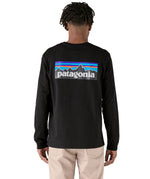 Rear view of the the black cotton Patagonia Adult  L/S P-6 Logo Responsibili-Tee, worn by an adult