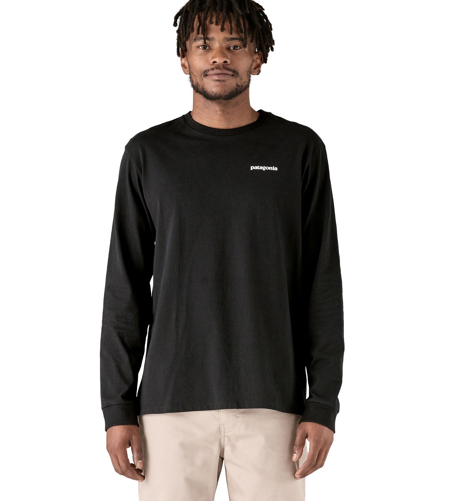 A adult wearing the black cotton Patagonia Adult  L/S P-6 Logo Responsibili-Tee. 