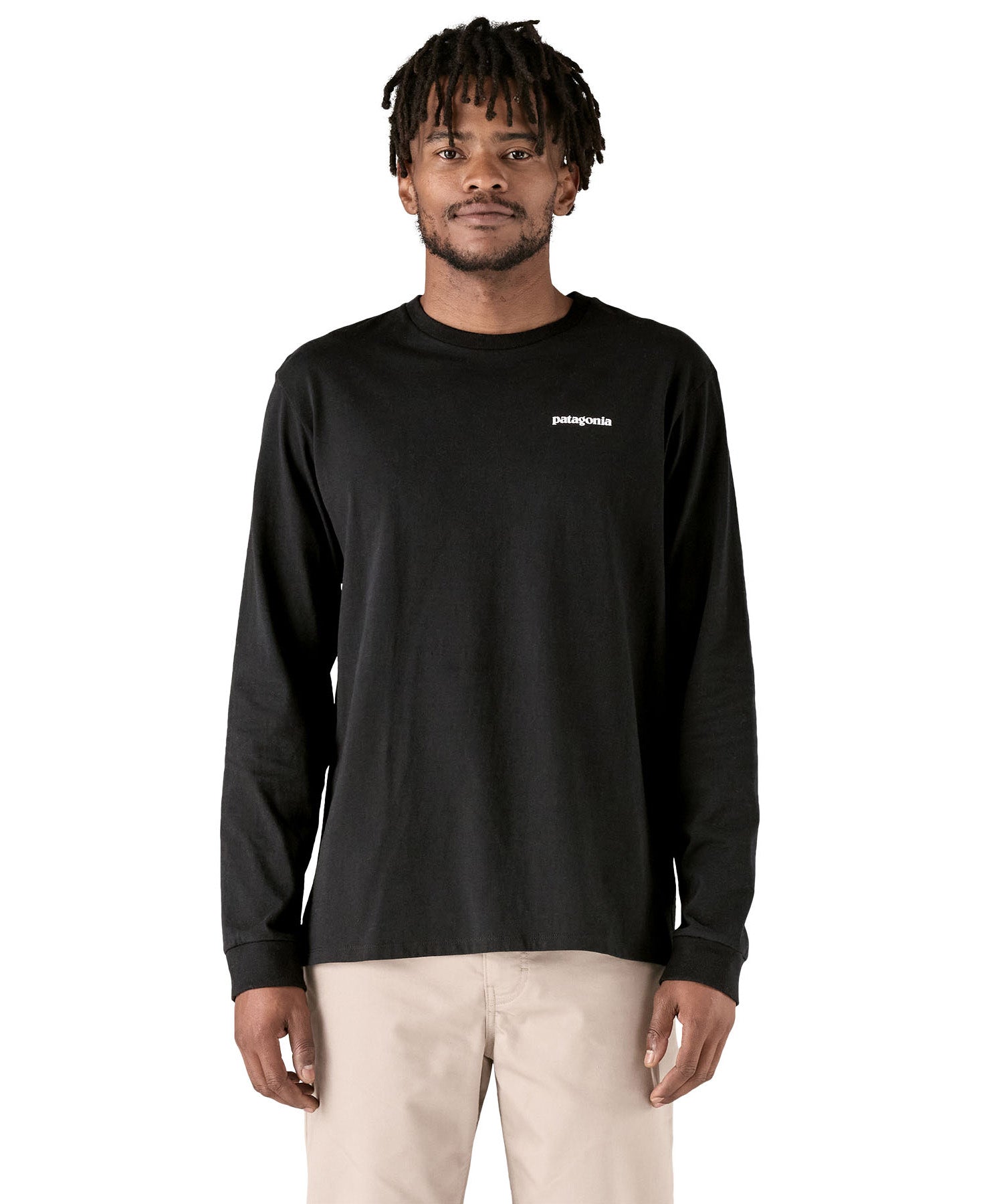 A adult wearing the black cotton Patagonia Adult  L/S P-6 Logo Responsibili-Tee. 