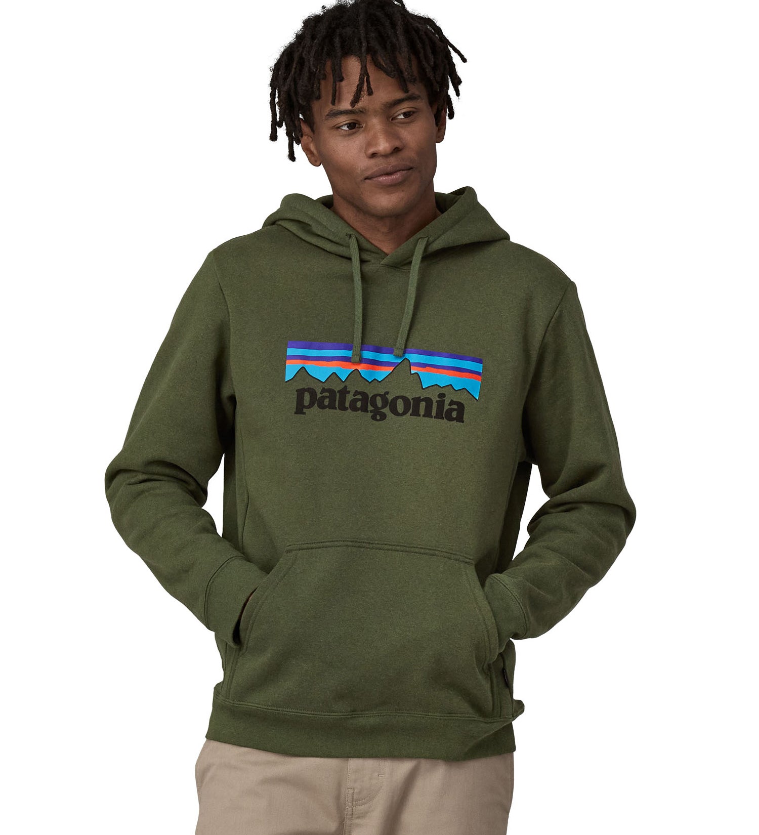 A man wearing a Patagonia Adult P-6 Logo Uprisal Hoody in a Torrey Pine Green colour, he is stood in front of a plain background.