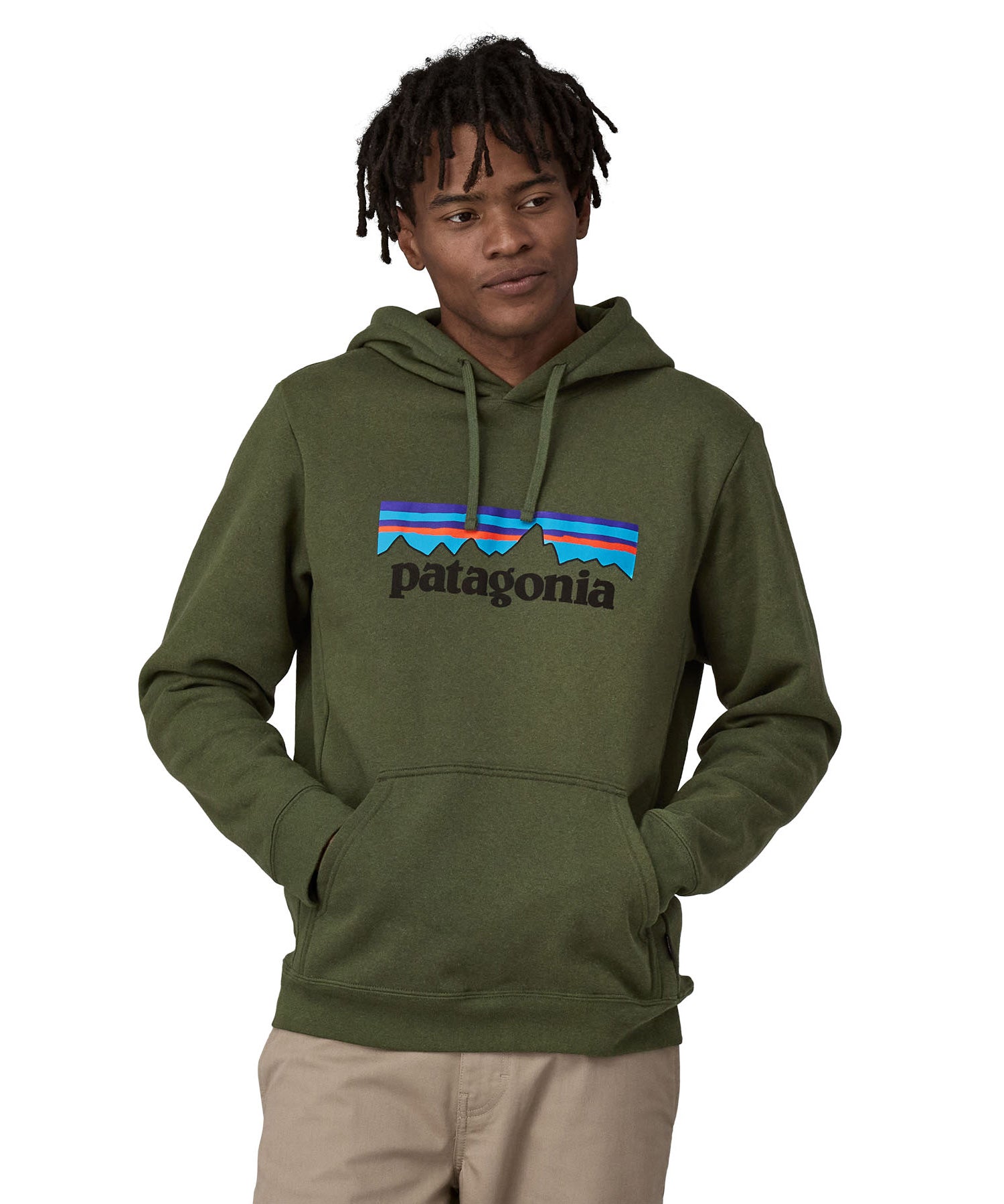 A man wearing a Patagonia Adult P-6 Logo Uprisal Hoody in a Torrey Pine Green colour, he is stood in front of a plain background.