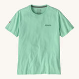 Patagonia adult short sleeve top in light green colour on a cream background.