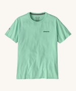 Patagonia adult short sleeve top in light green colour on a cream background.