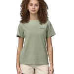 Patagonia adult short sleeve top in light green and logo text on the front worn by a woman