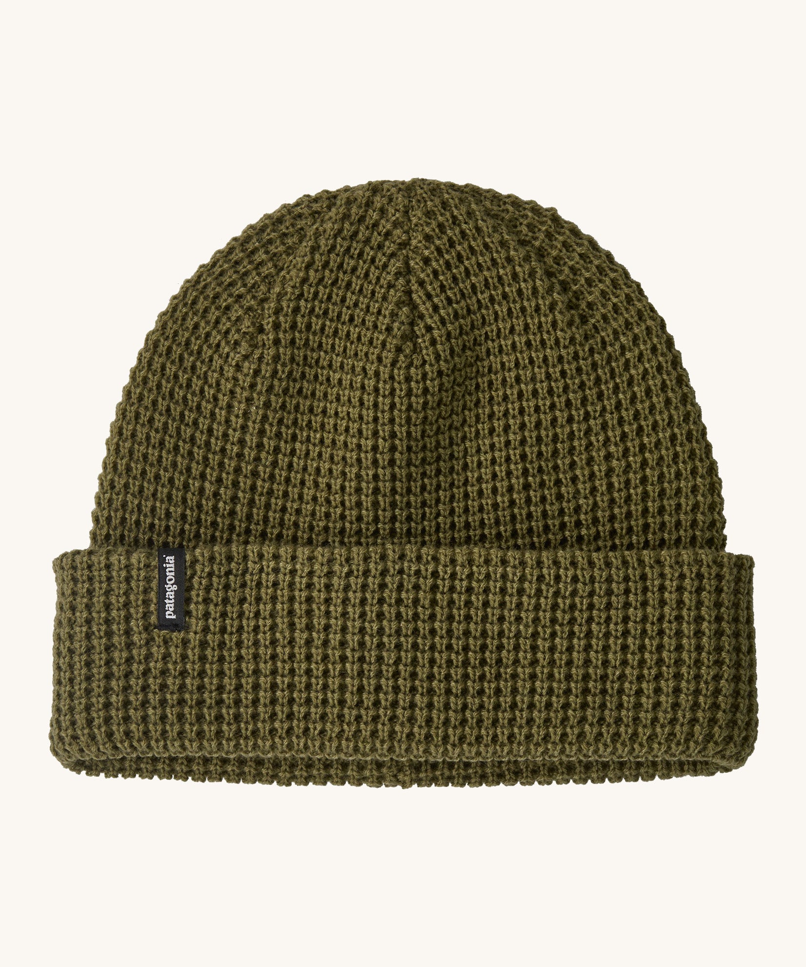 Patagonia adult snowdrifter beanie in tent green with rolled up brim. Features a brand logo patch stitched on the side