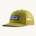 Patagonia adult trucker hat in green colour on a cream background.