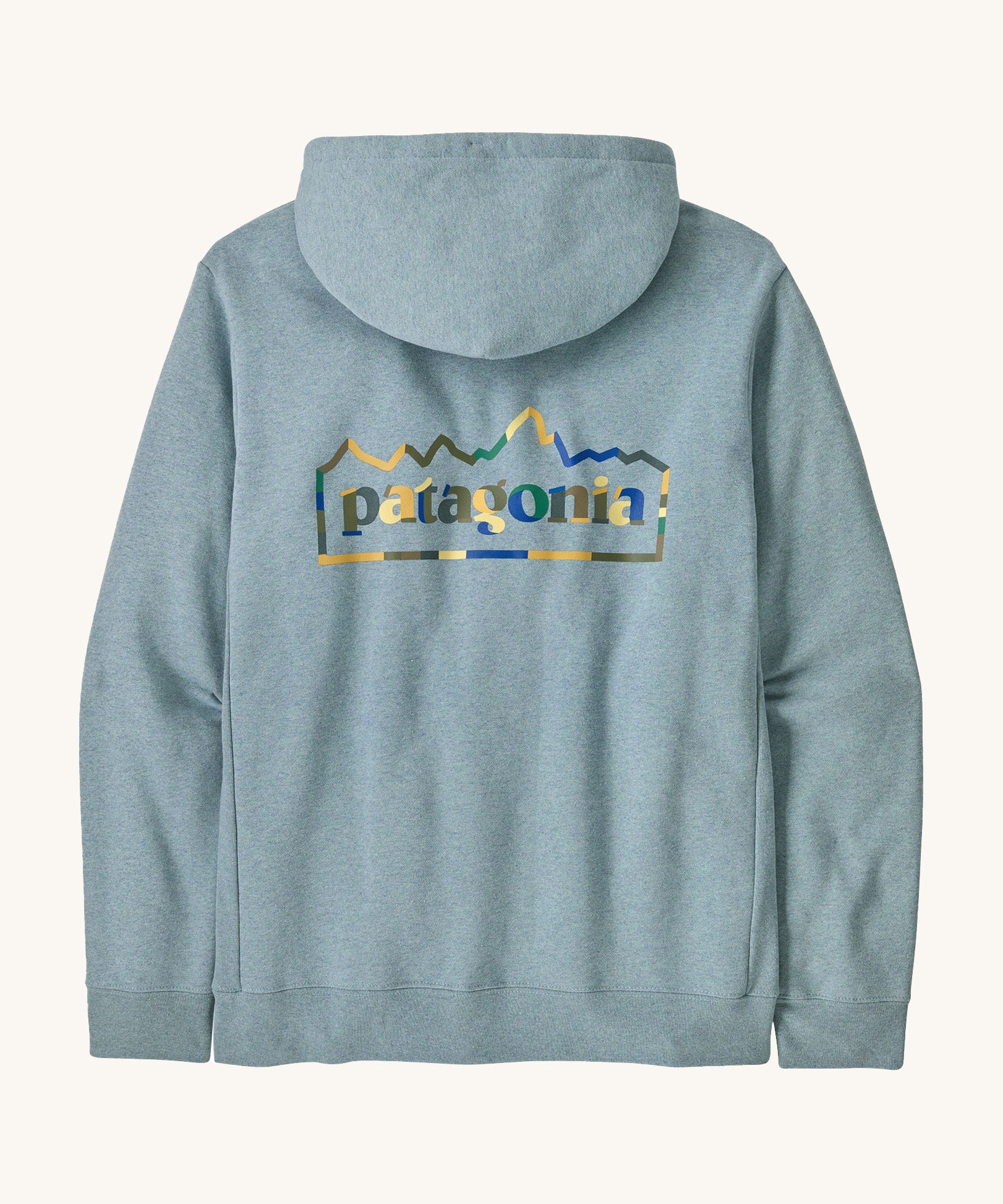 Patagonia adult unity hoodie in thermal lue with the logo design on the back on a cream backgroud.