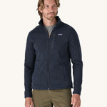 A man wearing the Patagonia Men's Better Sweater Jacket in a New Navy colour.