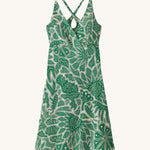 Patagonia women's amber dawn dress with retro green leaves design on a cream background.