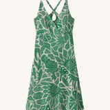 Patagonia women's amber dawn dress with retro green leaves design on a cream background.
