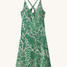 Patagonia women's amber dawn dress with retro green leaves design on a cream background.