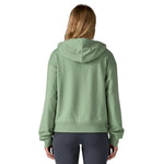 The back of a woman wearing the Patagonia women's Anhya hoody available at Babipur. 