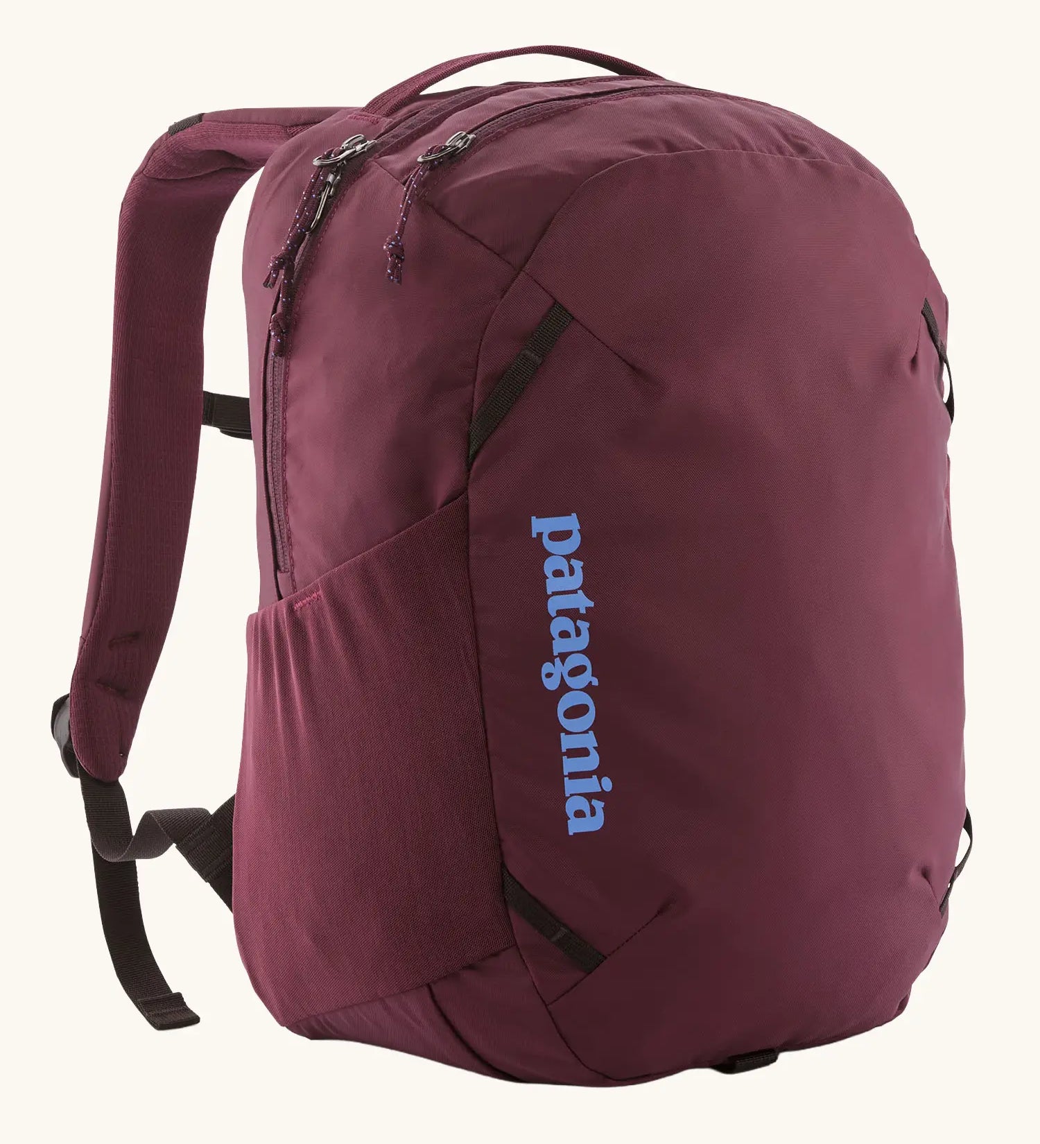 Patagonia atom day pack 24 litre backpack in berry fig. Two zipped compartments and bottle holders on the sides.