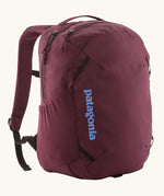 Patagonia atom day pack 24 litre backpack in berry fig. Two zipped compartments and bottle holders on the sides.