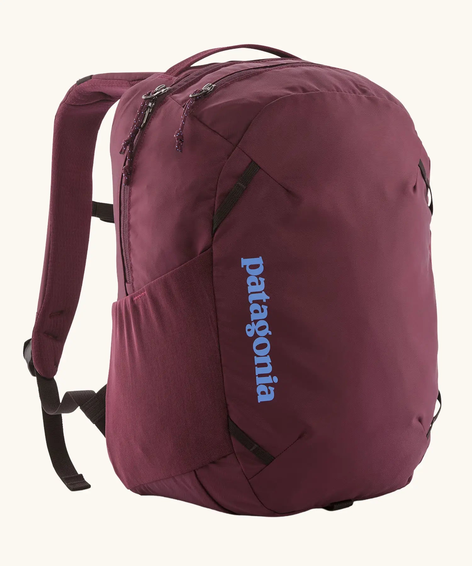 Patagonia atom day pack 24 litre backpack in berry fig. Two zipped compartments and bottle holders on the sides.