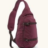 Patagonia atom sling 8L bag in berry fig. Over the shoulder strap with zipped compartments and equipment straps on the front.