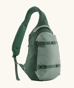Patagonia atom sling 8L bag in cover green. Over the shoulder strap with zipped compartments and equipment straps on the front.