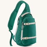 Patagonia atom cross body 8L sling bag in gem green with grey handle, zips, gear straps and buckles.
