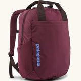 Patagonia atom tote bag backpack 20 litre in berry fig. One main zipped compartment, side bottle pockets, padded straps, chest strap and carry handles. 