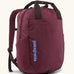 Patagonia atom tote bag backpack 20 litre in berry fig. One main zipped compartment, side bottle pockets, padded straps, chest strap and carry handles. 