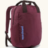 Patagonia atom tote bag backpack 20 litre in berry fig. One main zipped compartment, side bottle pockets, padded straps, chest strap and carry handles. 