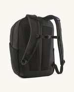 Back of the Patagonia atom 20 litre black tote bag backpack with padded straps and quick release buckle chest strap.