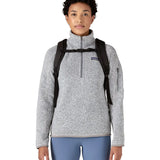 Person wearing the Patagonia atom 20 litre black tote bag backpack with the chest strap closed across their front.