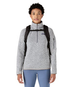 Person wearing the Patagonia atom 20 litre black tote bag backpack with the chest strap closed across their front.