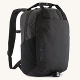 Patagonia atom 20 litre black tote bag backpack with zipped compartment, front and side drinks pocket, padded straps and carry handle.