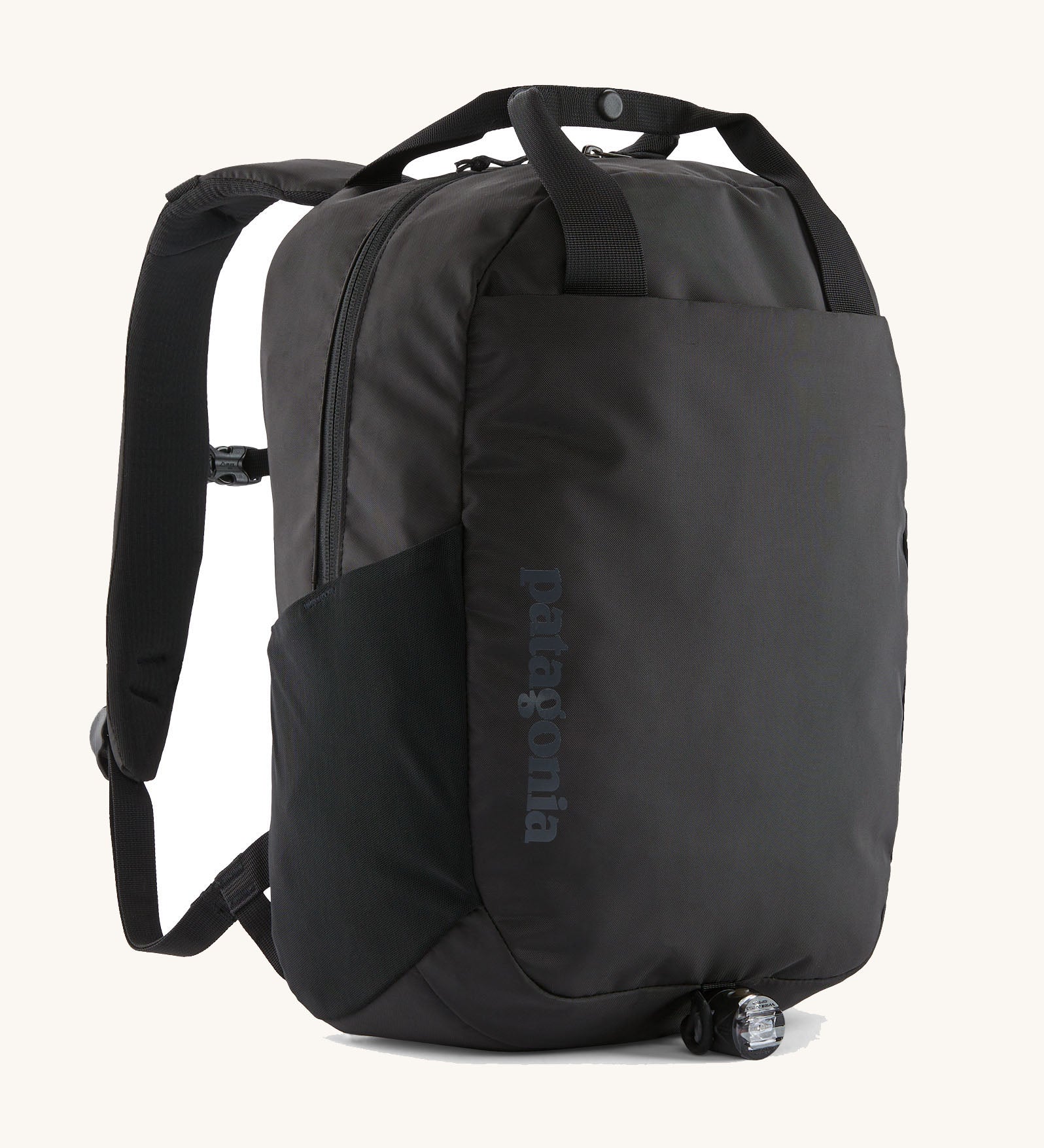 Patagonia atom 20 litre black tote bag backpack with zipped compartment, front and side drinks pocket, padded straps and carry handle.