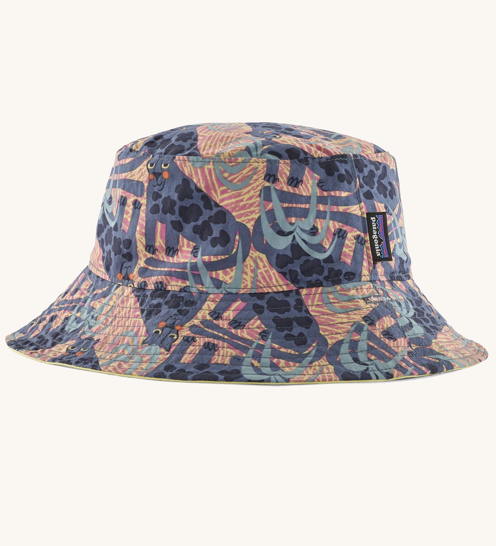 Patagonia reversible baby sun bucket hat shown with all over jaggy style faded magenta print.