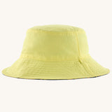 Patagonia reversible baby sun bucket hat shown on the plain light lime green side.