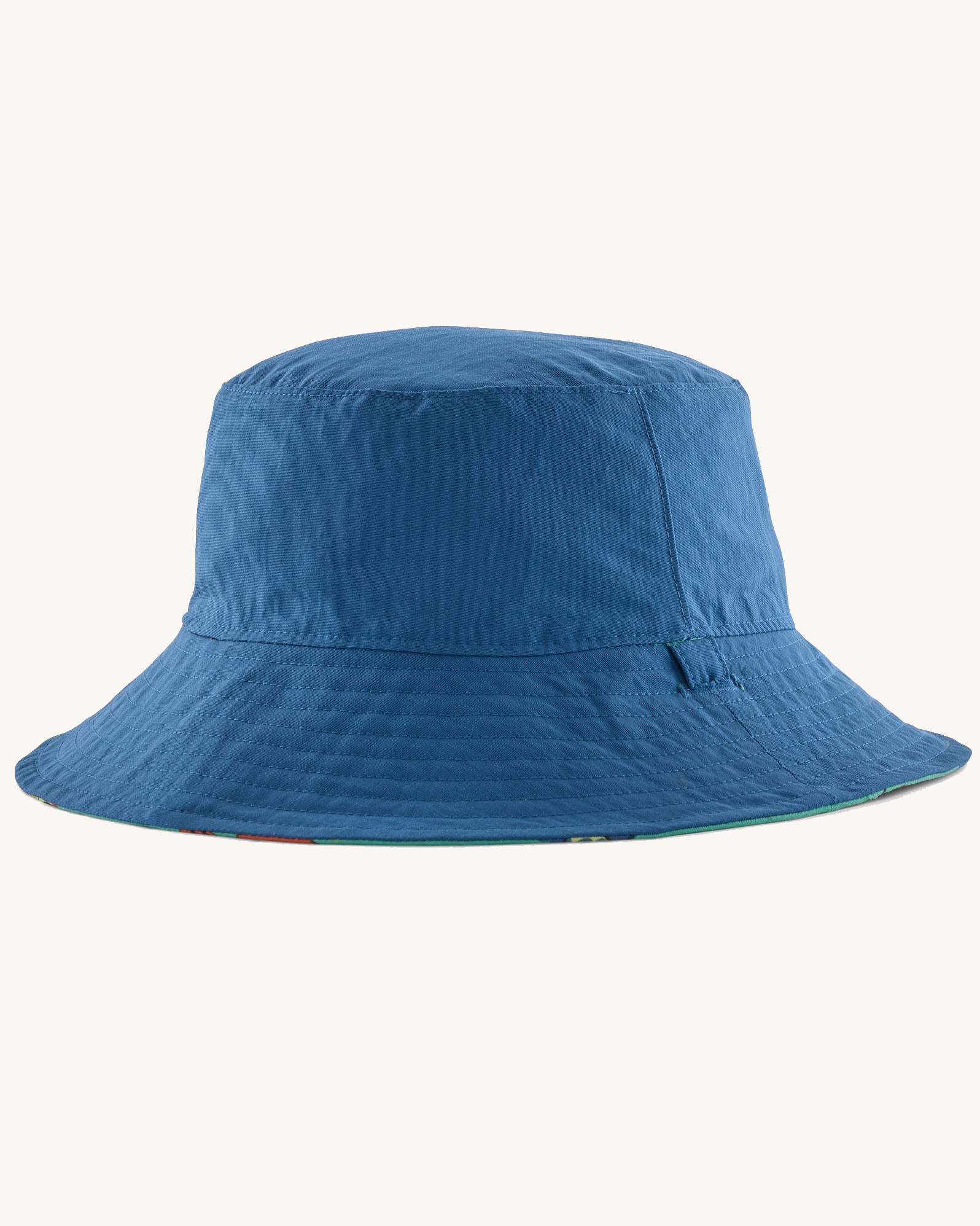 Patagonia reversible baby sun bucket hat one side shown on the plain blue.