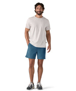 patagonia mens baggies shorts in a dark blue colour worn by a man 