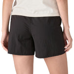 Patagonia women's baggies shorts in black worn by a woman back detail 