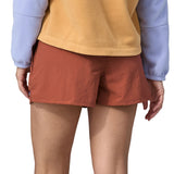 Patagonia women's barely baggies shorts in brown worn by a woman back detail