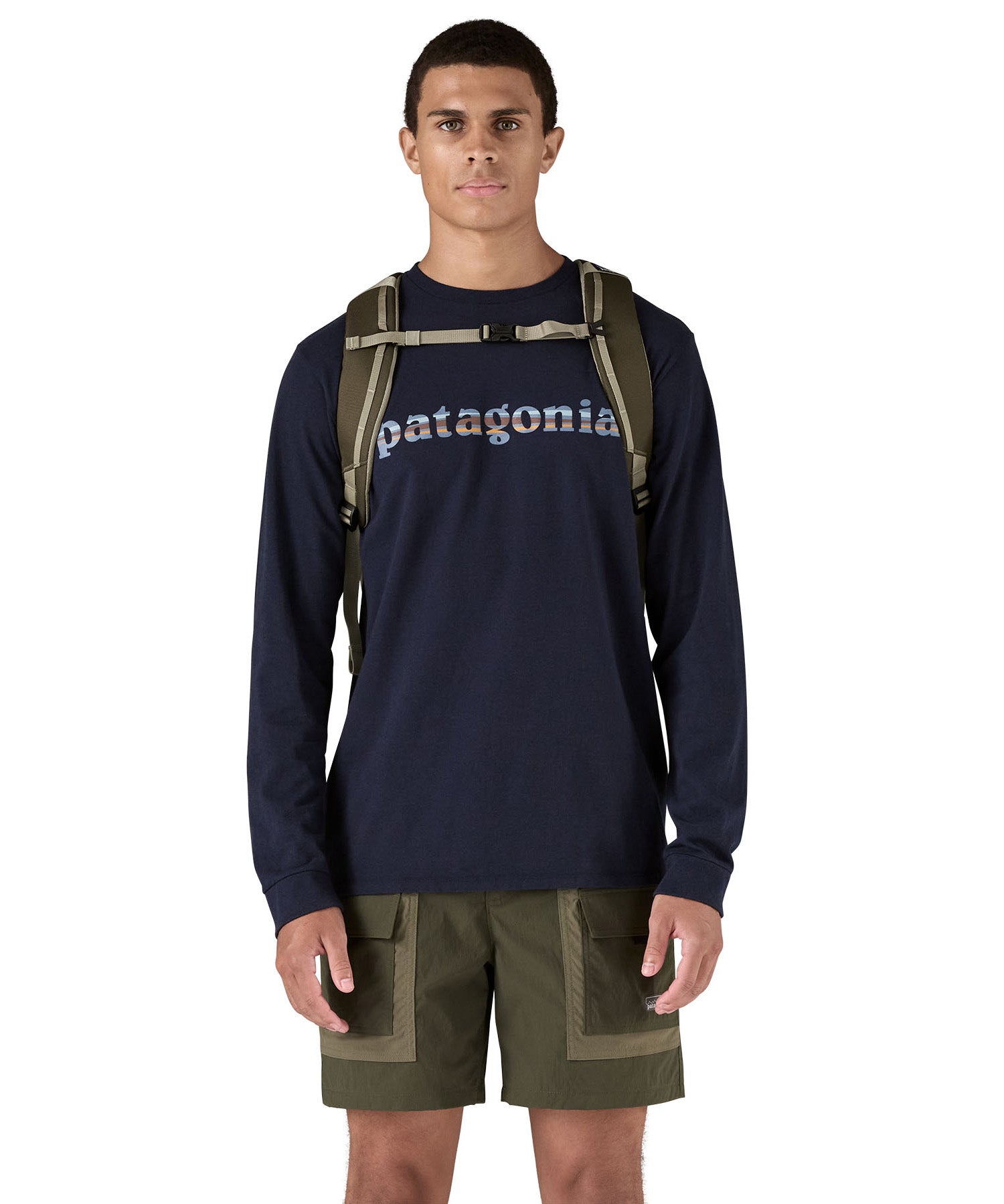 Patagonia 25L black hole backpack in a basin green colour shoulder strap and clip detail