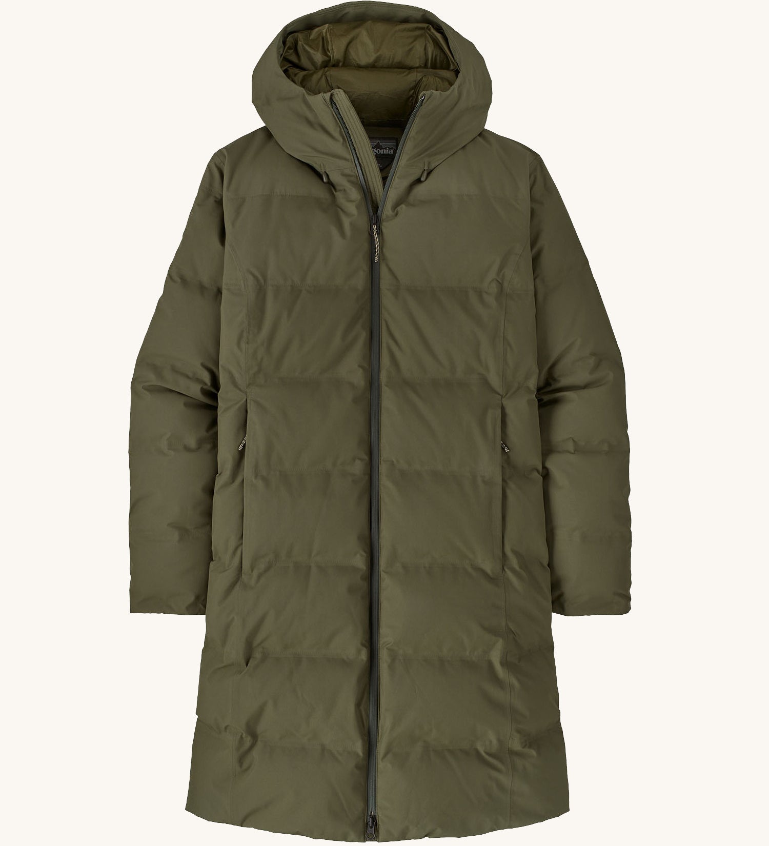 Patagonia women's glacier parka coat in basin green colour on a cream background.