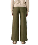 Rear view of the Patagonia women's basin green canvas trousers. Showing the wide leg fit and 2 back pockets