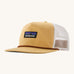 Patagonia airfarer cap in a beeswax colour on a cream background