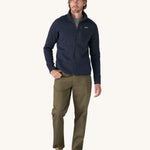 A man wearing the Patagonia Men's Better Sweater Jacket in a New Navy colour.