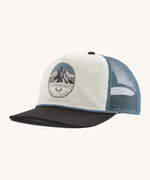 Patagonia airfarer cap in a birch white colour and Chouinard crest design on a cream background.