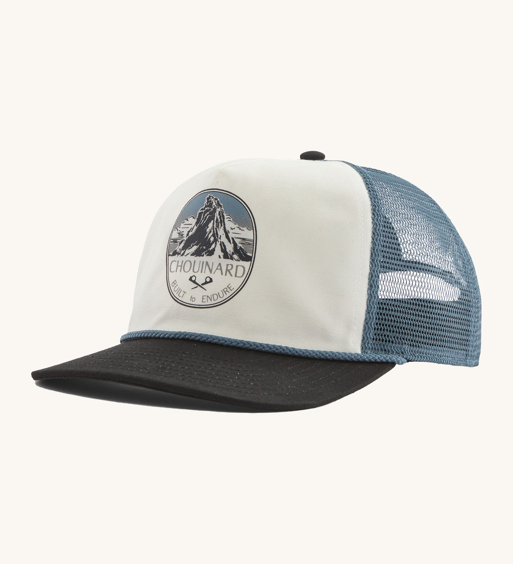 Patagonia airfarer cap in a birch white colour and Chouinard crest design on a cream background.