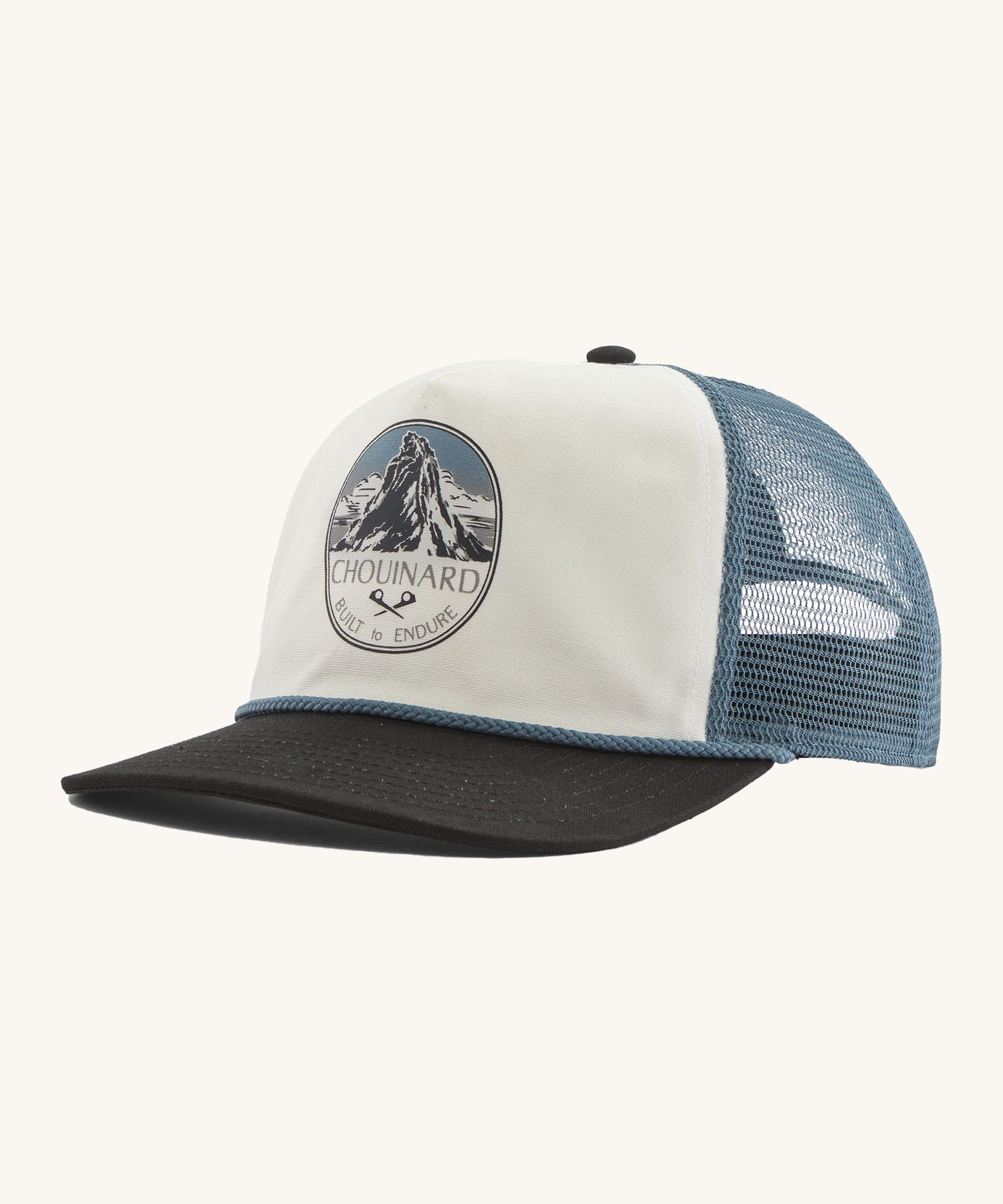 Patagonia airfarer cap in a birch white colour and Chouinard crest design on a cream background.