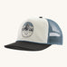 Patagonia airfarer cap in a birch white colour and Chouinard crest design on a cream background.