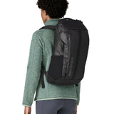 Person wearing the Patagonia Black Hole® Backpack 25 litre in black on their back. 